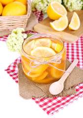 Tasty lemon jam on table close-up