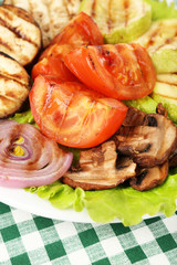 Delicious grilled vegetables on plate on table close-up