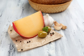 Tasty Italian cheese on wooden table