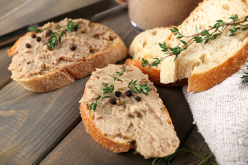 Fresh pate with bread on wooden table