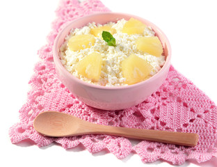 Bowl of tasty cottage cheese with pineapple, isolated on white