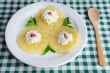 Tasty pineapple with cottage cheese, close up