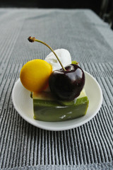 cheesecake with berries and macaron