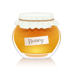 Honey in glass jar isolated on white background.