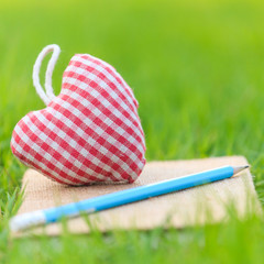 Fabric heart on diary