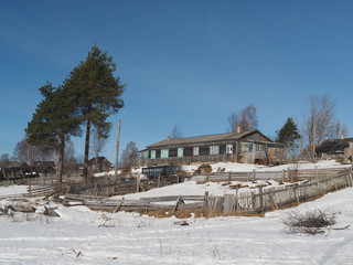 Wooden house in winter village