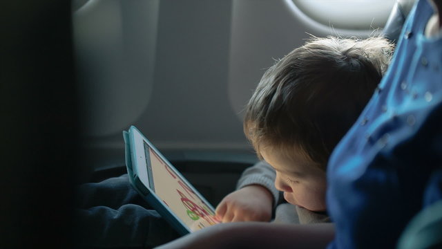 Little boy traveling in an airplane