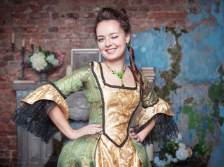 Beautiful woman in medieval dress winking