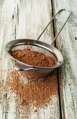 cocoa powder in a sieve