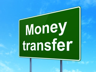 Finance concept: Money Transfer on road sign background