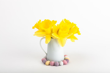 Vase of daffodils with eggs