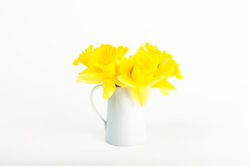 white vase of daffodils