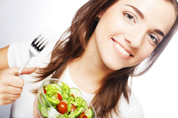 Smiling girl with a salad