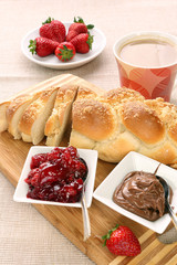 Sweet bread with cherry jam, and chocolate. Continental breakfas