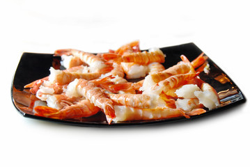 Shrimp tails on black dish