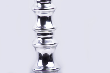 A candlestick close-up made of silver