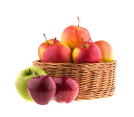 Apples in a wicker baskets, isolated on white background.