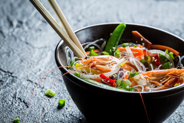 Shrimp and vegetables served with noodles