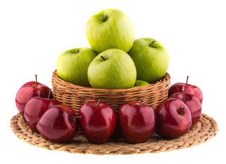 Fresh green and red apples in a wicker baskets, isolated