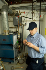 Fototapeta na wymiar Service technician repairs heat