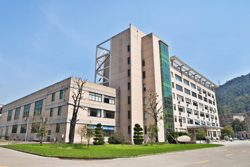Side view on the office building with parking lot