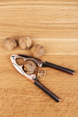 Nutcracker and walnuts  on wooden background