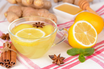 Healthy ginger tea with lemon and honey on table close-up