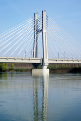 Fototapeta na wymiar Cable stayed bridge across river Po in Northern Italy