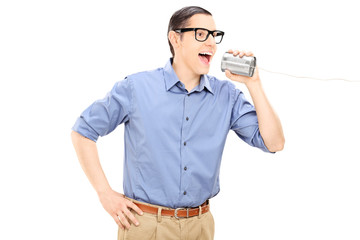Man talking through a tin can phone