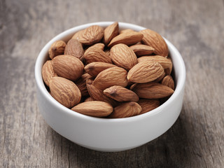 white bowl full of almonds