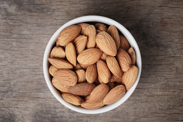 white bowl full of almonds