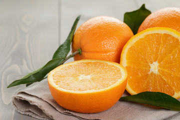 ripe oranges on wooden table