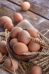 eggs in a wooden bowl on a linen canvas