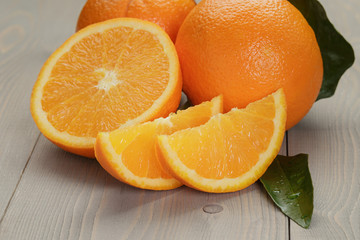 ripe oranges on wooden table