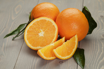 ripe oranges on wooden table