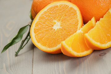 ripe oranges on wooden table © GCapture
