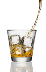 whiskey being poured into a glass