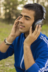 Young man enjoying listening to music