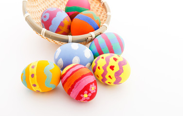 Children drawing easter egg in basket