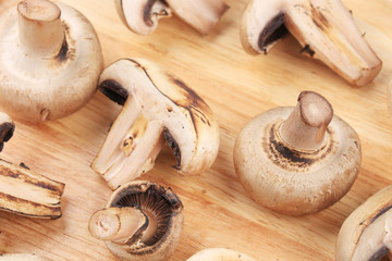 Mushrooms on wooden platter. Close up.