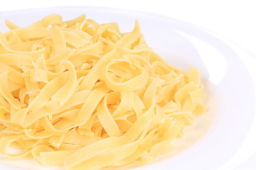 Tagliolini on plate close up. Macro.