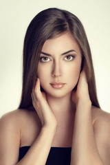 Beauty portrait of woman brunette with straight long hair