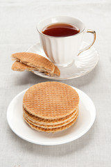 tea in a cup with biscuits