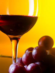 grape and glass with red wine