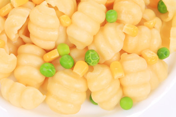 Pasta with green peas and corn.