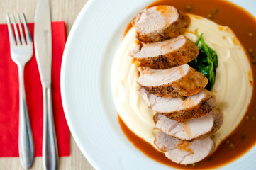 Mashed potatoes with grilled pork at local restaurant