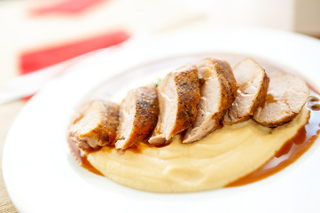 Close-up of grilled pork with mashed potatoes as main course