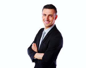 Portrait of a happy businessman with arms folded 