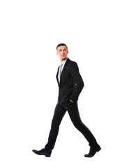 Side view portrait of a businessman walking