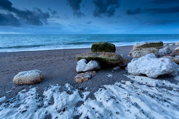 rocky ocean coast in dusk